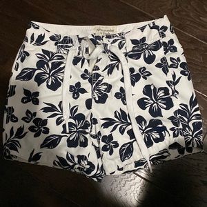 white swim trunks with black flowers